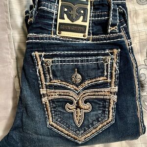 Rock Revival Men's Blue Jeans with Embroidered Pockets